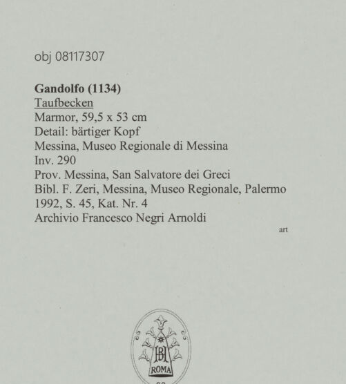 Rückseite von unbekannt [https://www.deutsche-digitale-bibliothek.de/content/lizenzen/rv-ez/] Taufbecken - Detail: bärtiger Kopf, bh606162_recto. Foto.